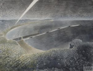 A view looking down into a wide bay from the cliff tops. The curve of the land stretches along the left side of the composition, and a searchlight beams up into the sky further along the coast. Several small boats are seen motoring out to sea from a jetty in the centre ground of the composition.