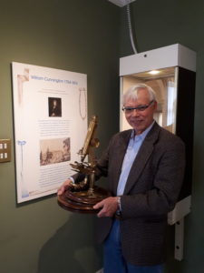 John Cunnington presenting his great great grandfather's microscope to the Museum