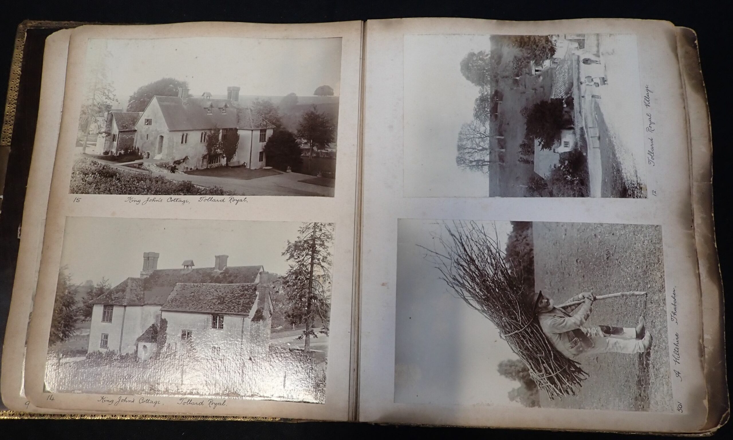 Inside pages of the dirty and smoke damaged Wiltshire Thatcher photo album. One of the four images shows a man bent over, using a stick and carrying a bundle of sticks. It is this image that was used on the Led Zeppelin IV Photo Album.
